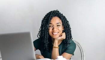 Smiling woman with computer